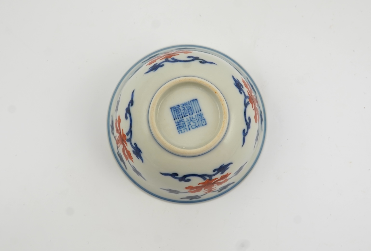 A Chinese underglaze blue and iron red bowl, Daoguang seal mark and possibly of the period